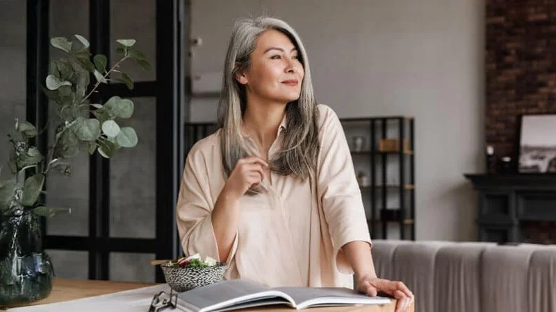 Woman Standing 2 TBT Woman standing in a modern living room, looking out the window, representing probate exemptions. Learn more in our complete guide. Contact Kid Breukelen Realty Group for guidance.